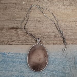 Handcrafted wire wrapped bail pendant.Clay back front is decor paper in resin